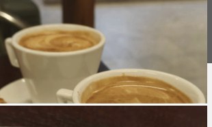 Two cups of Greek coffee on the counter